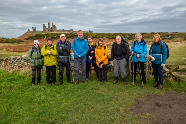 Group and Dunstanburgh Castle