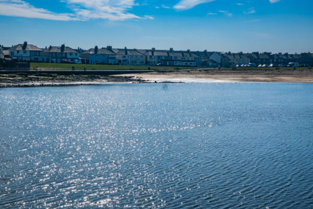 Sunshine across the bay at Amble