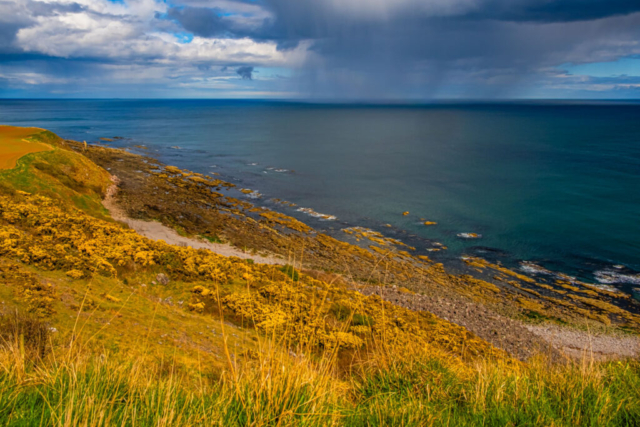 Our lunch-stop at Catcairn Bushes with rain over the sea Our lunch-stop at Catcairn Bushes