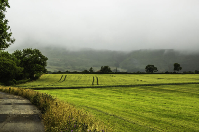 Heading towards Cote House with thick cloud over Busby Moor